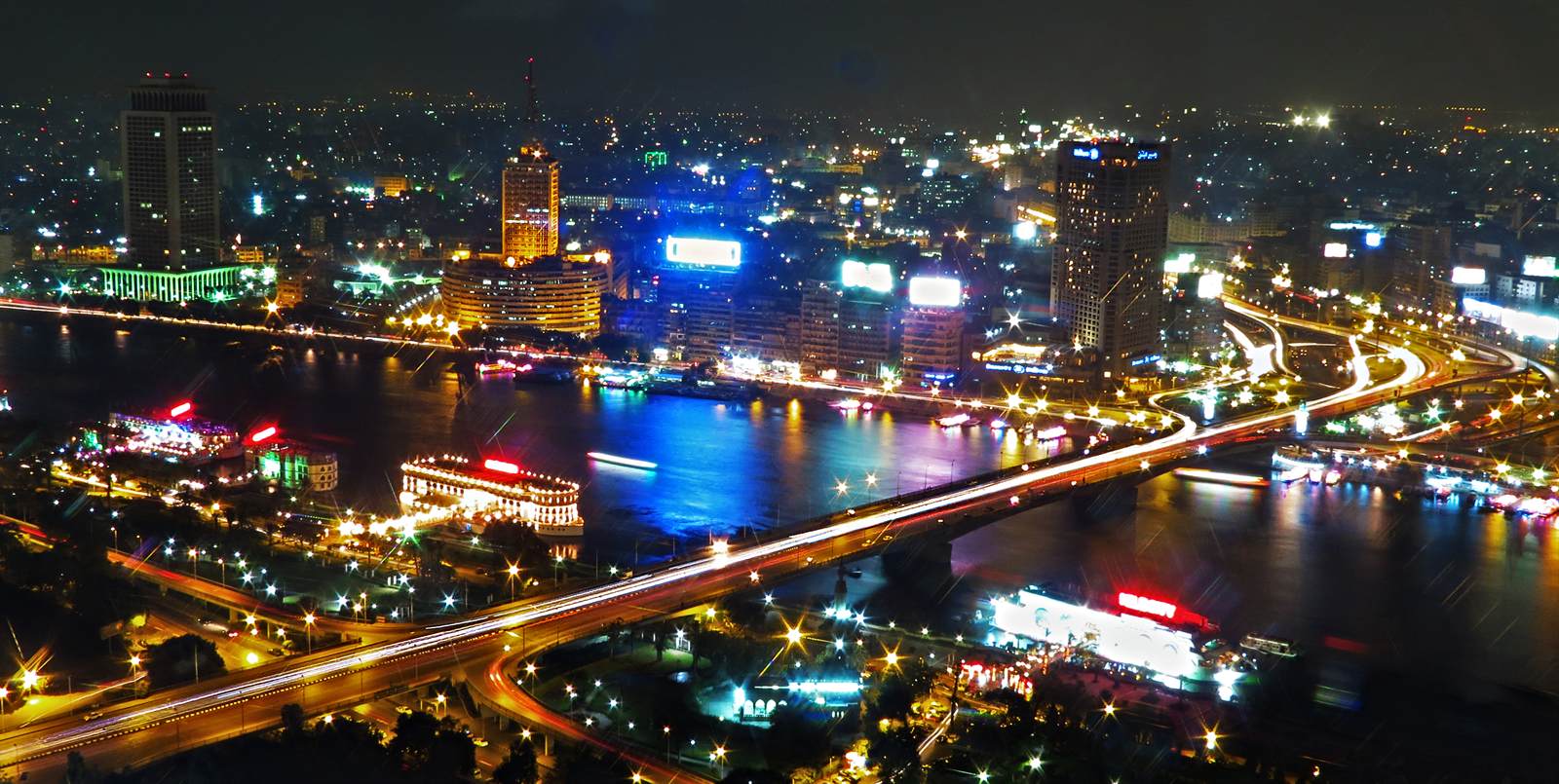 Cairo and the Nile illuminated at night before a welcome dinner cruise