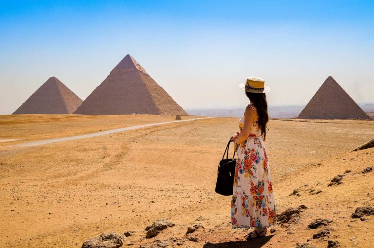 Traveller at the Giza Pyramids while planning an Egypt itinerary