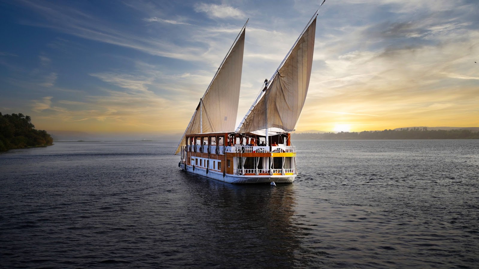 Dahabeya Amoura sailing on the Nile at sunset