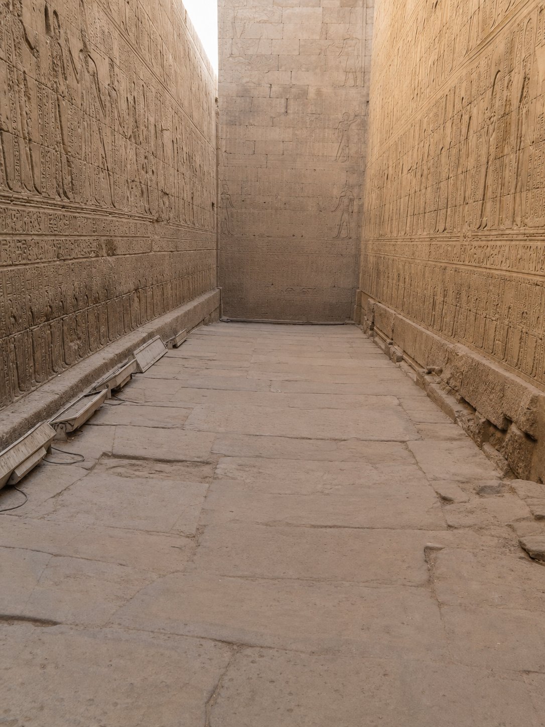 Relief-lined passage inside Edfu Temple on the Aswan to Luxor Nile cruise
